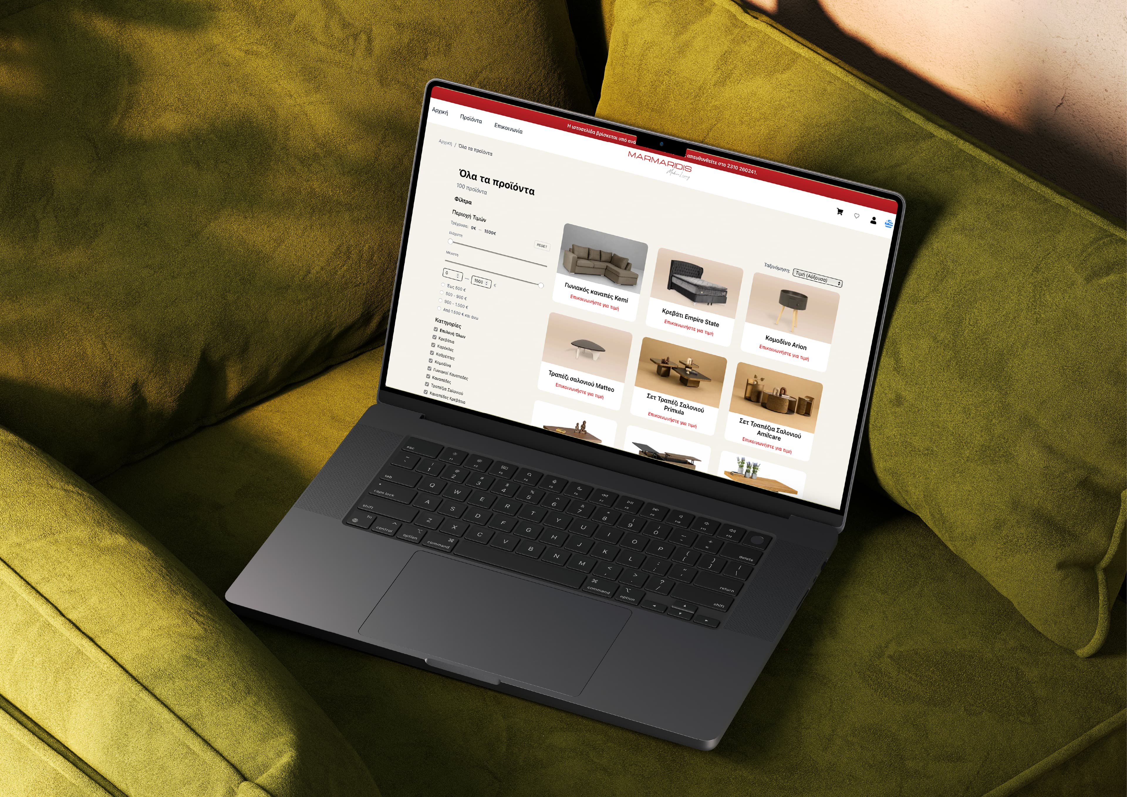Marmaridis laptop on couch